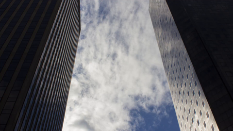 two corporate office buildings with 4K timelapse clouds in Manhattan NYC