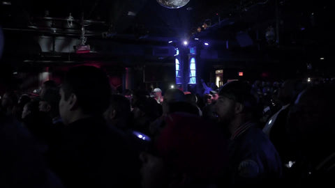 panning through crowd of fans in hip hop concert - rap show