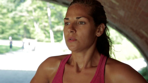 athlete huffing and puffing catching breath after intense exercise in Central Park - contact us for model details