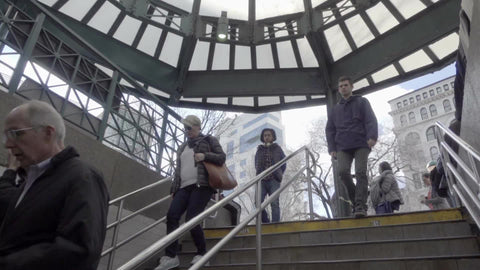 people walking downstairs at Union Square subway station entrance on winter day in slow motion 1080 HD in NYC