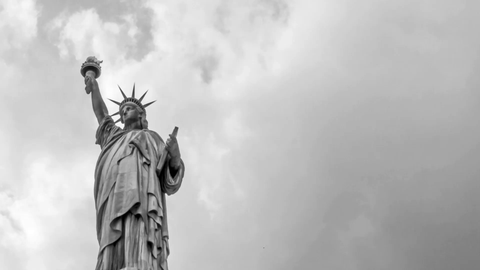 Statue of Liberty black and white vintage old fashioned archival style shot with dust and scratches - 4K upward angle timelapse in New York City