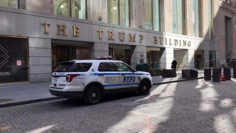 The Trump Building with police car parked outside Downtown Manhattan NYC