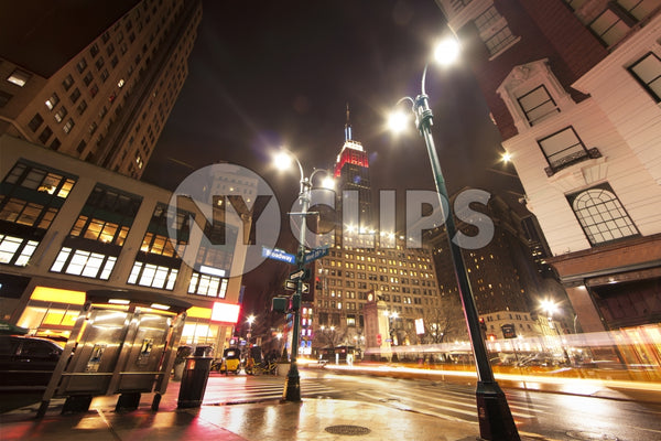 Herald Square with Empire State Building at night in Manhattan New York City NYC