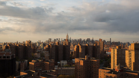 Empire State Building and Manhattan skyline viewed from Lower East Side aka LES public housing buildings - 4K timelapse day to night