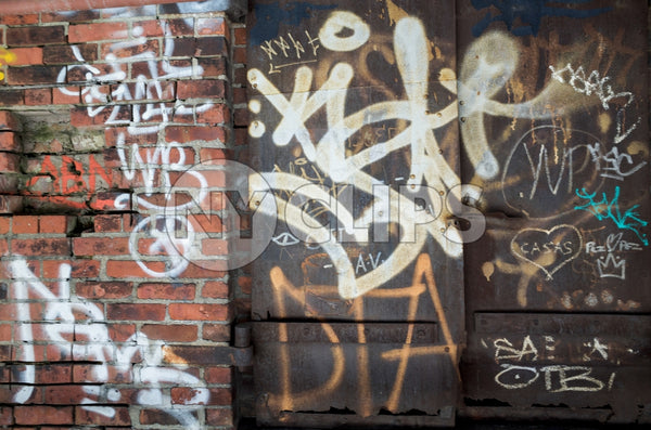 graffiti on gritty brick wall and metal door