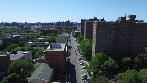The Bronx with Manhattan skyline on horizon - aerial of housing projects