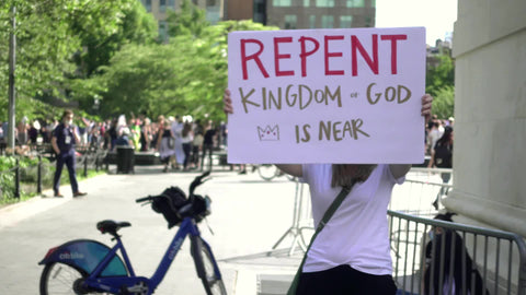 Evangelist proselytizing in Washington Square Park with repent kingdom of God is near - Jesus Christ