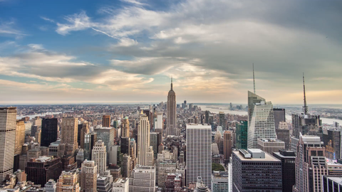 Empire State Building cityscape tilting down 4K timelapse day to night - skyscrapers in Manhattan