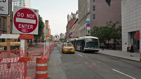 do not enter sign in Cooper Square with caravan taxicab turning corner