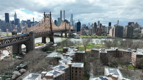 aerial over Queensbridge projects toward Queensboro Bridge and Manhattan skyline New York City