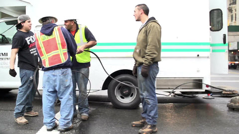 construction workers in slow motion on street in NYC