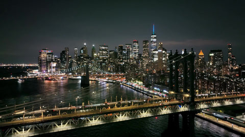aerial following cars Manhattan Bridge night New York City