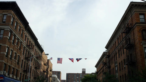 Puerto Rican and American flag in the Bronx - flags overhead in the neighborhood