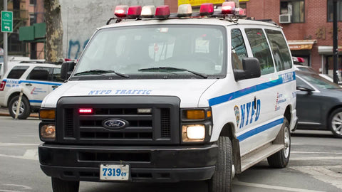 police van with turret lights flashing - NYPD vehicle