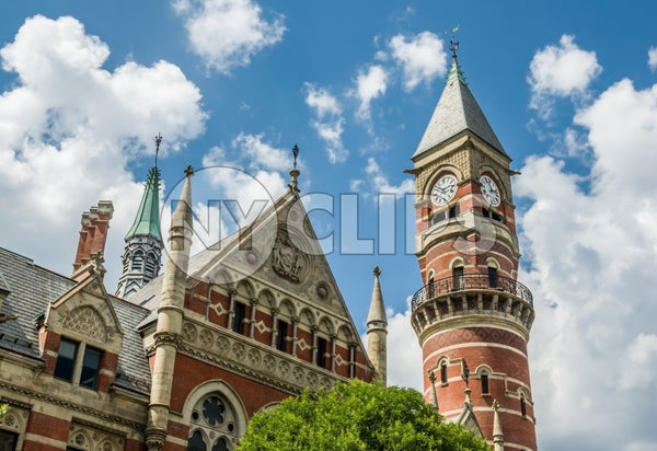 close up of Jefferson Market Library clock tower in Greenwich Village on bright blue sky day