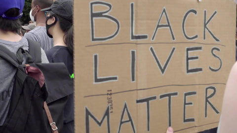 Black Lives Matter sign on cardboard at BLM rally