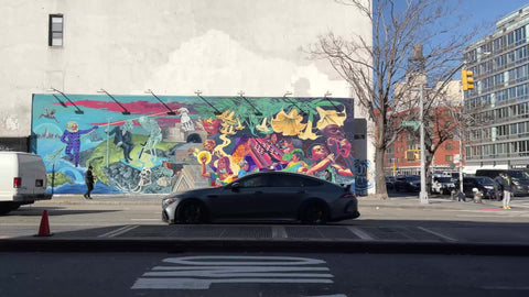 driving Houston Street past 3rd Ave Empire State Building view Manhattan New York City NYC