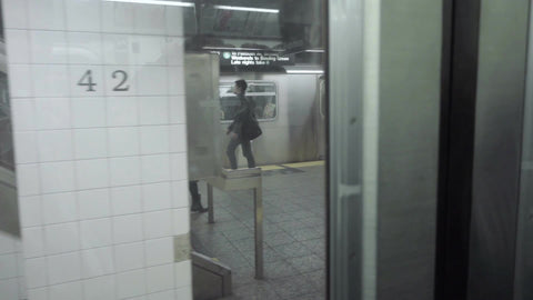 subway train leaving station from inside car passenger view from window pov at platform moving NYC