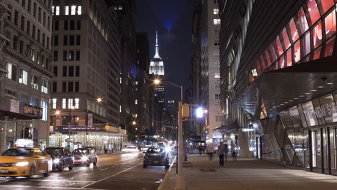 The New School on Lower Fifth Avenue at night with Empire State Building view - zooming out slowly in timelapse of Manhattan in 4K and 1080 HD in NYC