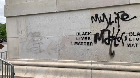 Black Lives Matter graffiti on arch in Washington Square Park wall in New York City NYC