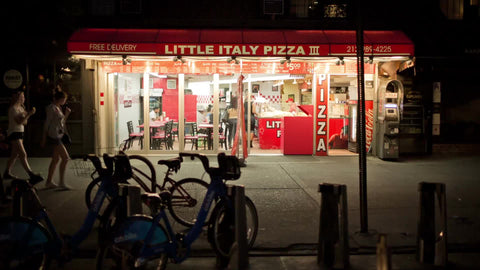 Little Italy Pizza sign - pizzeria at night in NYC