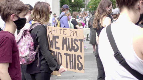 allies of Black Lives Matter - caucasian boy holding white people must end this sign at BLM rally in Manhattan NYC