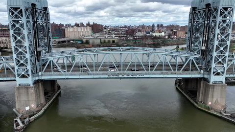 aerial RFK Bridge in East Harlem over river in NYC