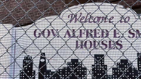 Smith Houses sign and fence housing projects in Two Bridges neighborhood Lower East Side Manhattan LES New York City NYC