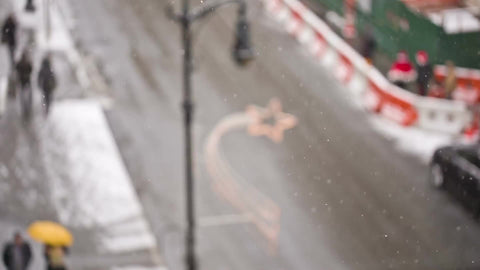 snow on street in winter - overhead view of Manhattan road with cars and taxi cabs in NYC