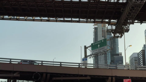 cars driving toward Brooklyn Bridge entrance on elevated FDR Drive highway Manhattan New York City NYC