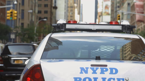 tailgating NYPD police car driving close - rear - cops on road in Manhattan