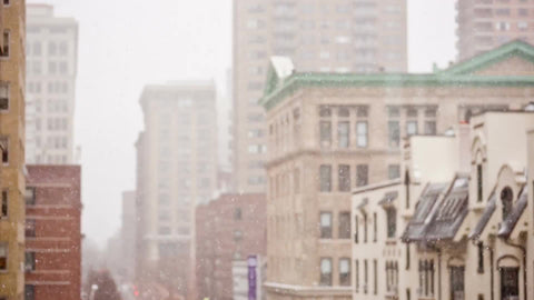 snowy winter day snowing in Manhattan window view snow storm - blizzard falling daytime