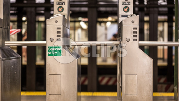 subway turnstile in station with special entry sign - empty platform in New York City NYC