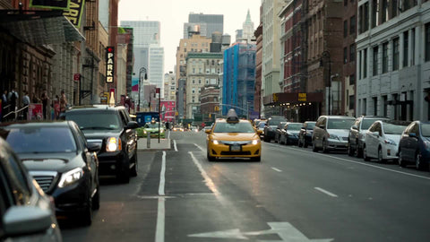 taxi cab driving down Lafayette Street in Cooper Square Greenwich Village outside Joe's Pub Theater in NYC