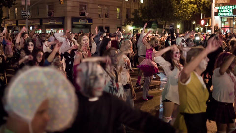 Halloween parade - costumes and monsters doing Michael Jackson Thriller dance - people dancing on 6th Ave and 8th Street in Greenwich Village