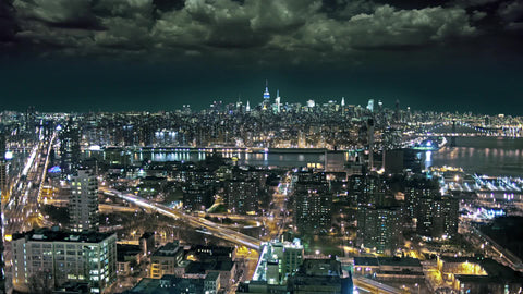 timelapse of storm clouds overhead from Brooklyn with Manhattan skyline view at night New York City