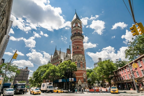 Jefferson Market Library clock tower in Greenwich Village on sunny day in summer