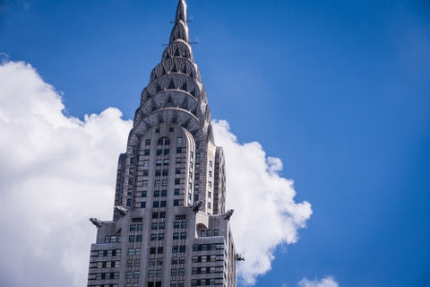 Chrysler Building famous Art Deco style skyscraper close-up with blue sky on summer day in Manhattan NYC