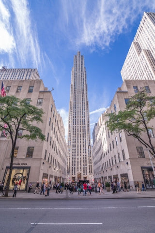 Rockefeller Center on sunny day with blue sky and clouds in Midtown Manhattan