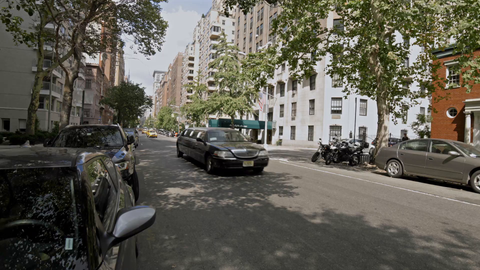stretched black limousine driving down Lower 5th Avenue - 4K in Manhattan New York City