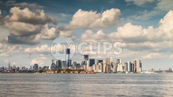 Manhattan skyline with Freedom Tower under construction and skyscrapers with blue sky and beautiful fluffy clouds