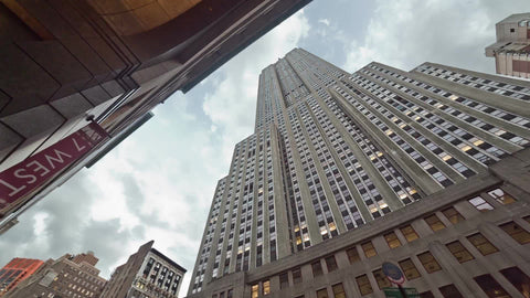 Empire State Building rotating shot from low street view looking up at towering skyscraper