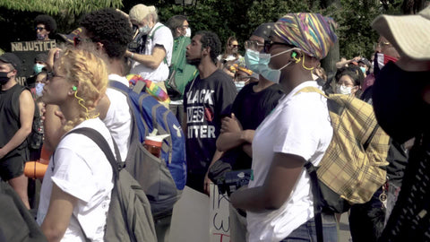 Black people listening to speech at BLM rally in New York City