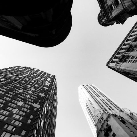 upward angle of tall towering skyscrapers - buildings from street view looking up in Manhattan