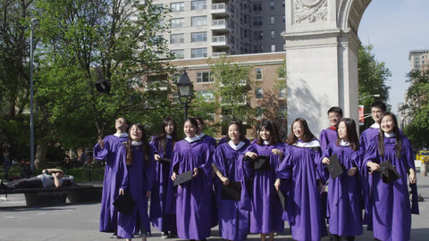 students graduating throwing caps in air - girls in cap and gown in Washington Square Park celebrating graduation in 1080 HD and 4K NYC