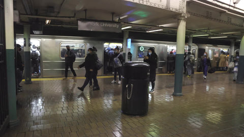 people walking with masks in subway train station platform Astor Place NYU stop New York City NYC