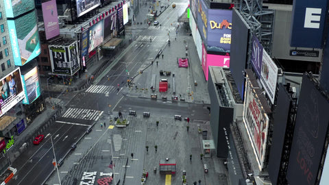 rising aerial over empty Times Square during day with sign during Covid pandemic New York City NYC