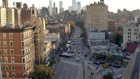 aerial moving forward toward 6th ave traffic and cars Manhattan New York City NYC