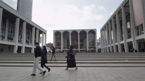 driving past Lincoln Center main entrance front steps on fall day in Manhattan New York City