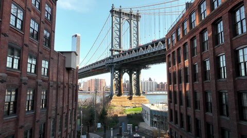 pushing in on Empire State Building view from Manhattan Bridge from Brooklyn New York City